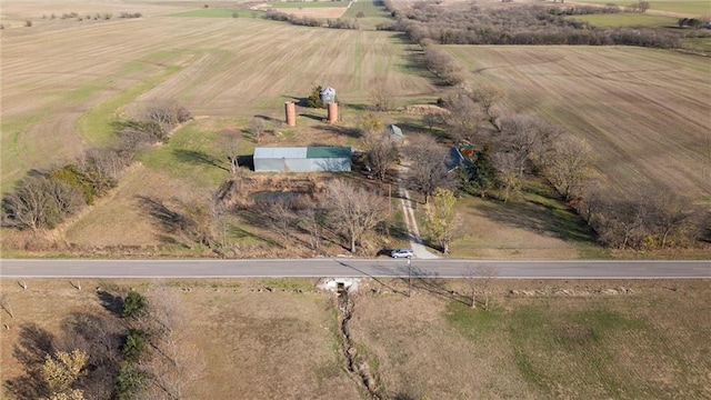 birds eye view of property with a rural view