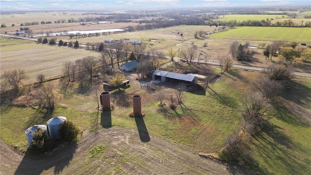 birds eye view of property with a rural view