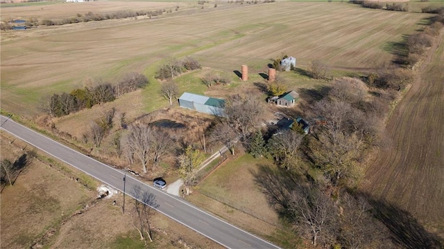 birds eye view of property with a rural view