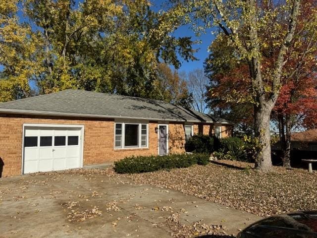 single story home featuring a garage