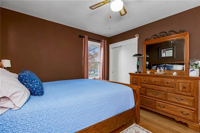 bedroom featuring light wood-type flooring and ceiling fan