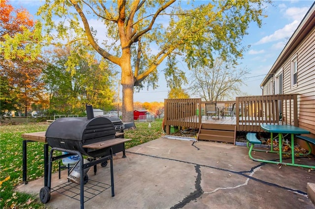 view of patio / terrace featuring a grill and a deck