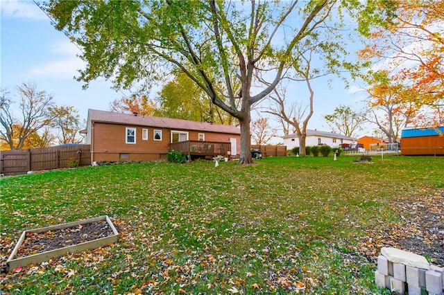 view of yard with a wooden deck