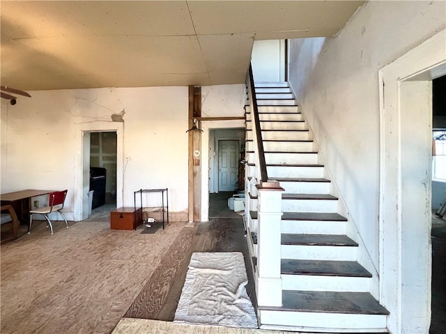 stairway featuring hardwood / wood-style flooring