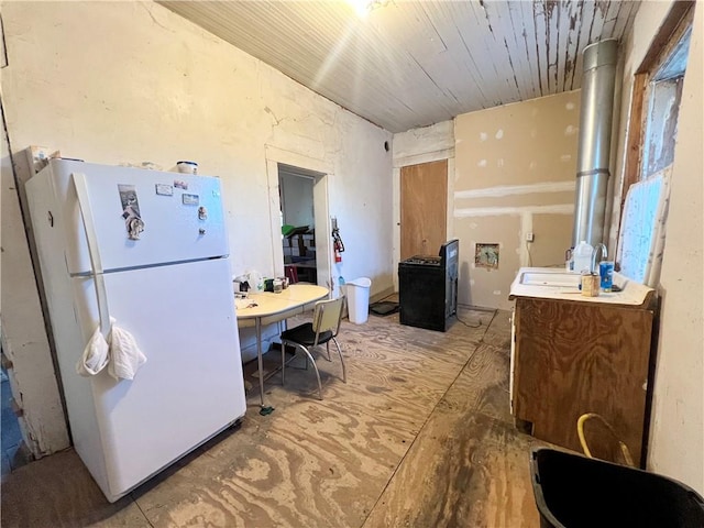 kitchen featuring white fridge