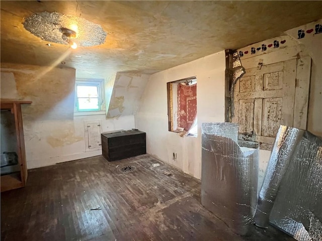 bonus room featuring dark wood-type flooring