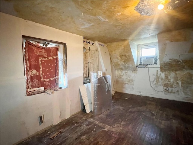 interior space featuring cooling unit and dark wood-type flooring