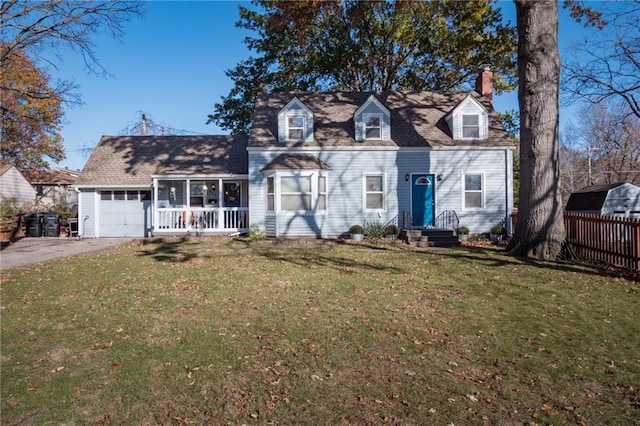 cape cod house featuring a garage and a front yard