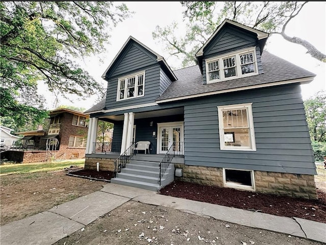 1610 S Olive St, Pittsburg, KS 66762 - view of front of property featuring roof with shingles, a porch, and french doors