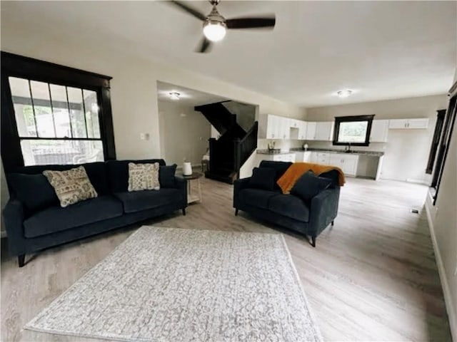1610 S Olive St, Pittsburg, KS 66762 - living room featuring light wood-style flooring and ceiling fan