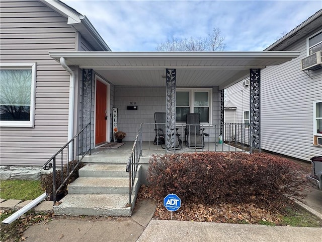 doorway to property featuring covered porch