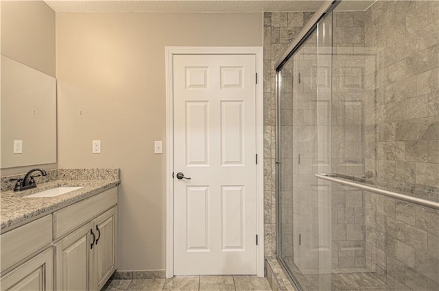 bathroom with vanity and walk in shower