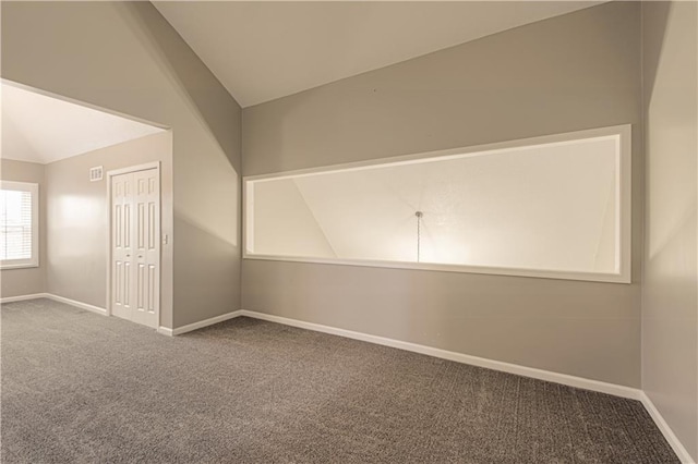 bonus room with carpet flooring and lofted ceiling