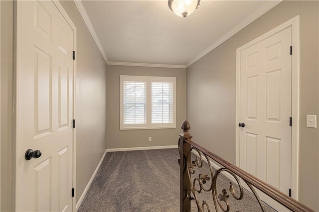 hall featuring dark carpet and ornamental molding