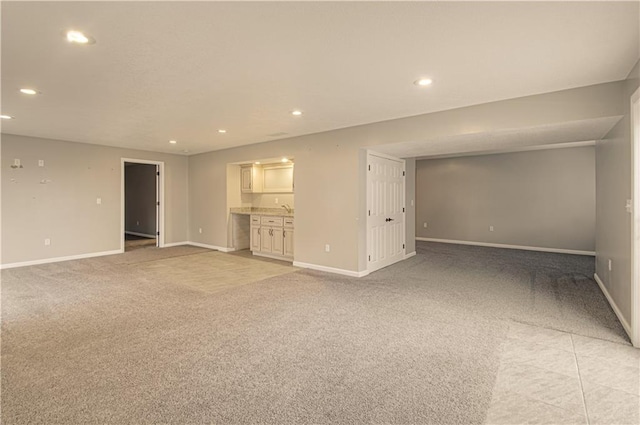 unfurnished living room featuring light colored carpet