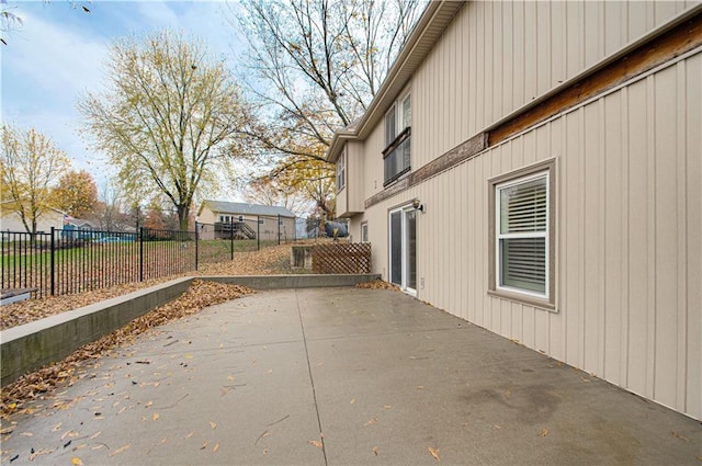 view of side of property with a patio area