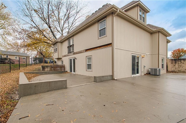 back of house with a patio area and central air condition unit