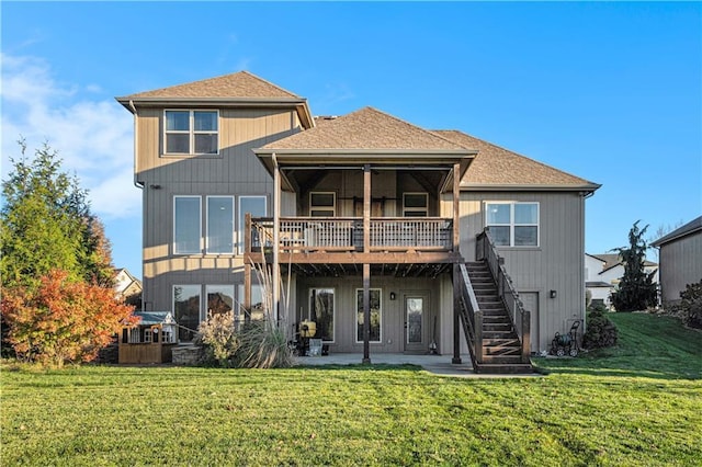 back of house featuring a yard, a deck, and a patio area