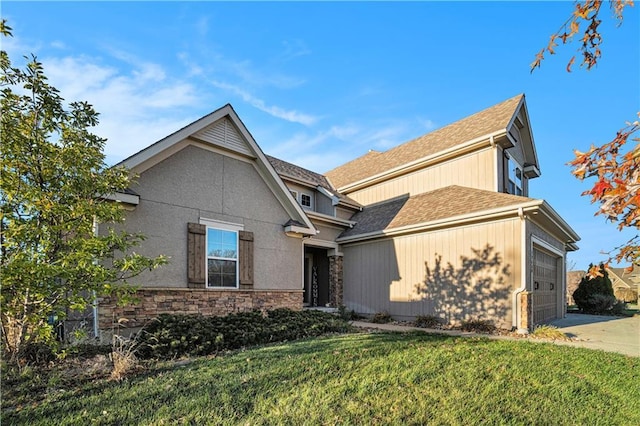 view of front of house featuring a garage and a front lawn