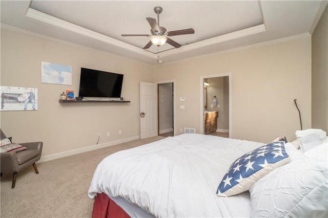 carpeted bedroom featuring ornamental molding, a raised ceiling, and ceiling fan