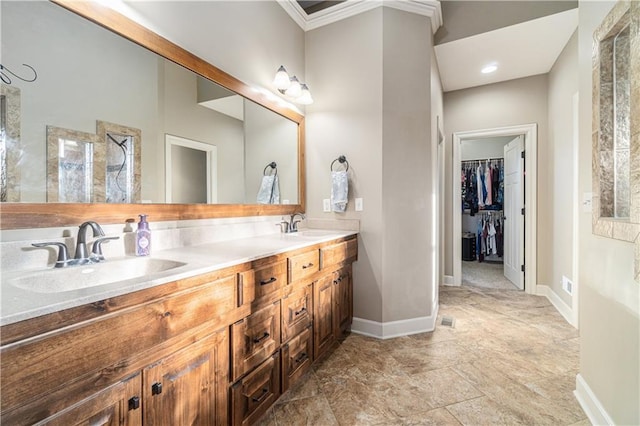 bathroom featuring ornamental molding and vanity