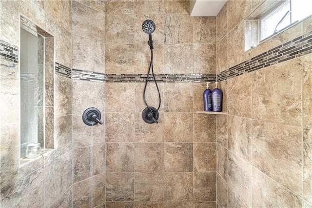 bathroom featuring a tile shower