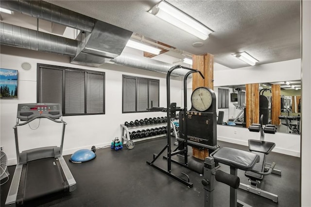 gym featuring a textured ceiling