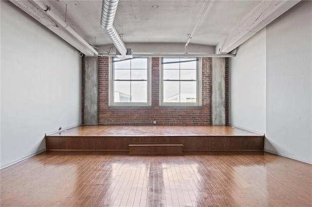 empty room with hardwood / wood-style flooring