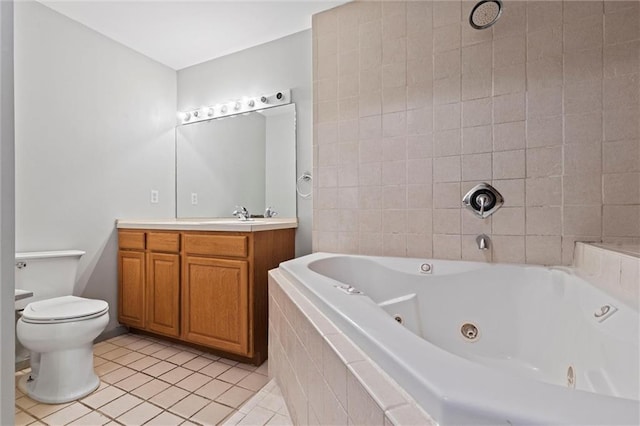 bathroom with tile patterned floors, vanity, a relaxing tiled tub, and toilet