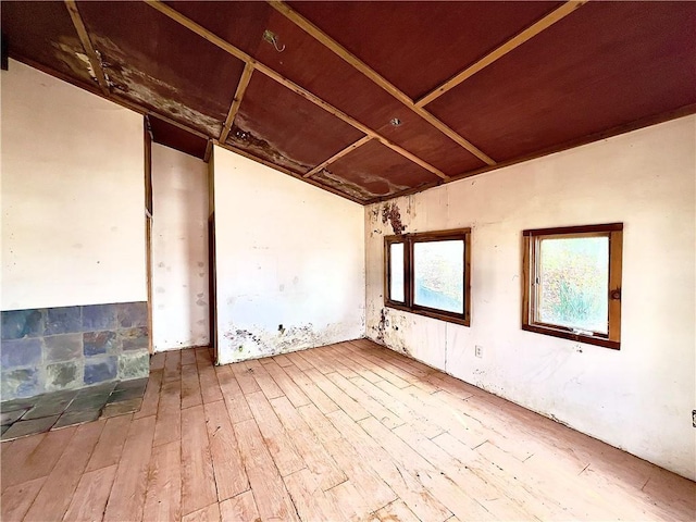 8401 E Lake View Dr, Freeman, MO 64746 - empty room with hardwood / wood-style flooring and lofted ceiling