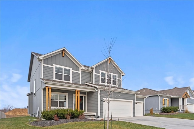 view of front of house featuring a garage, covered porch, and a front lawn