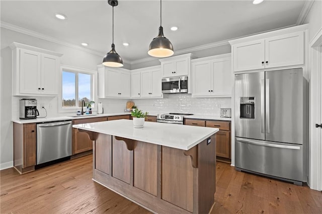 kitchen with white cabinetry and appliances with stainless steel finishes