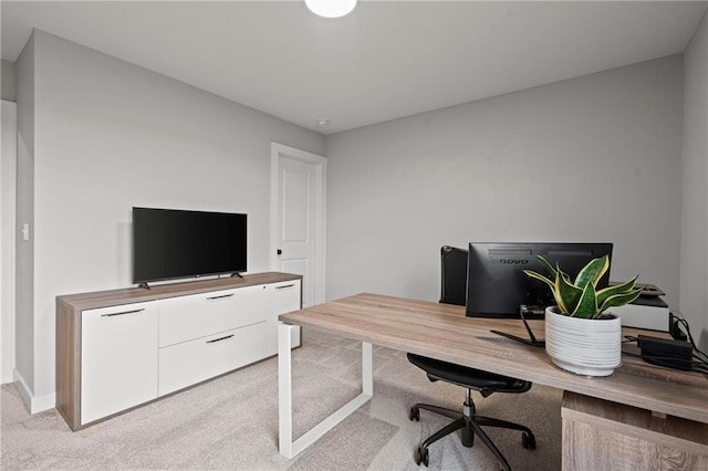 office area featuring light colored carpet