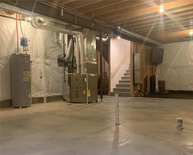 basement featuring heating unit and water heater