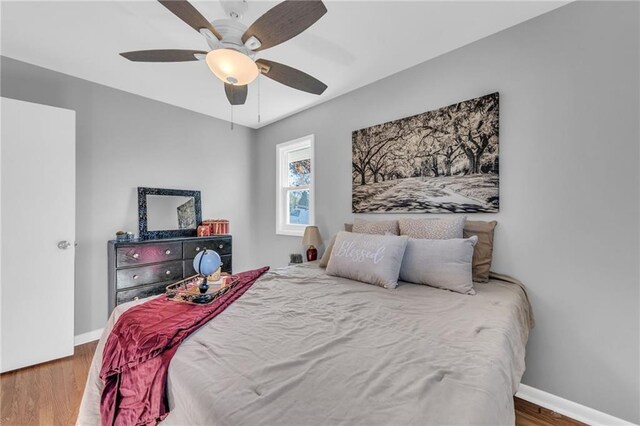 bedroom featuring ceiling fan and wood-type flooring