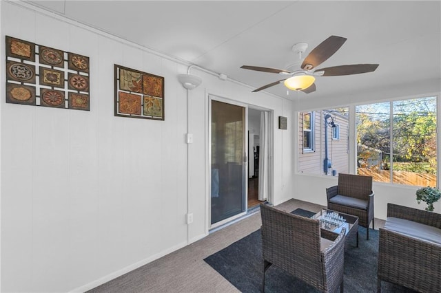 sunroom featuring ceiling fan