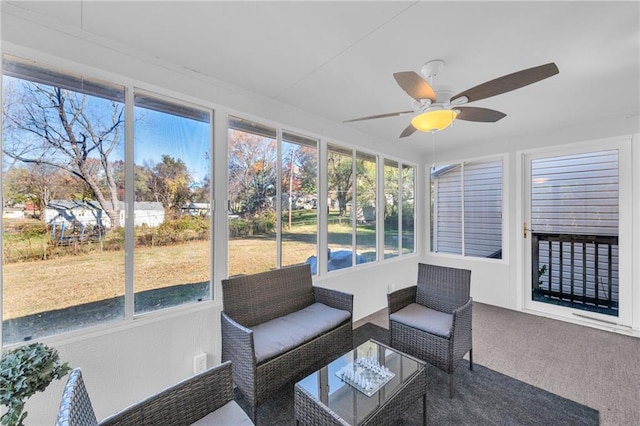 sunroom with ceiling fan and plenty of natural light