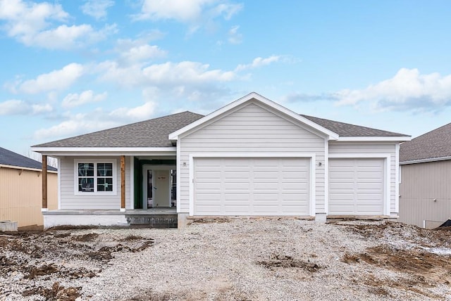 ranch-style home featuring a garage