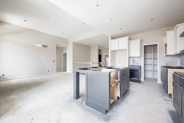 kitchen with gray cabinets, white cabinetry, and a center island