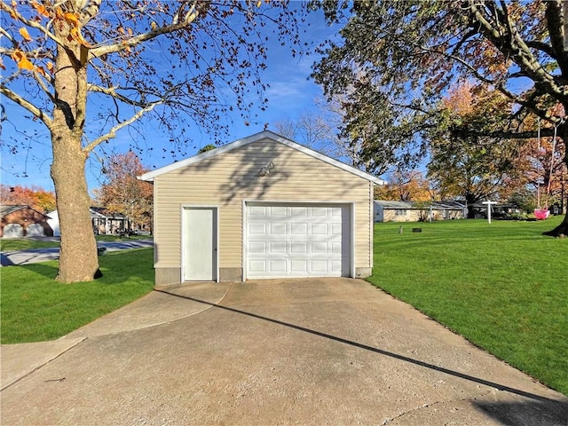 garage featuring a yard