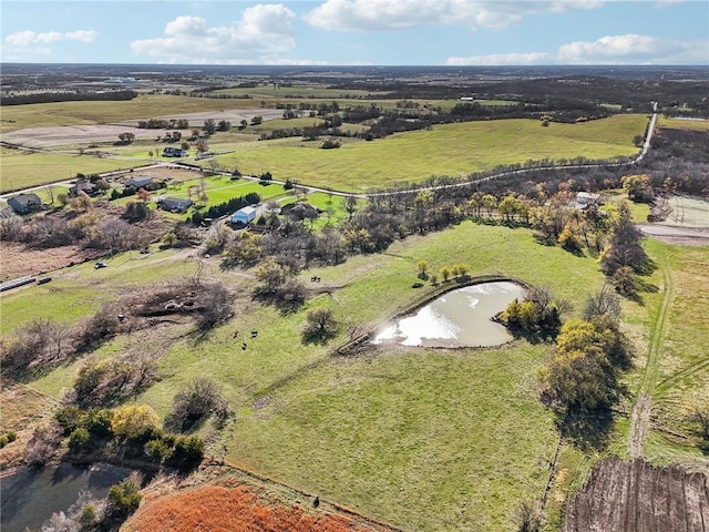 birds eye view of property with a water view and a rural view