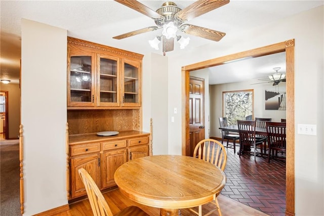 dining space with ceiling fan