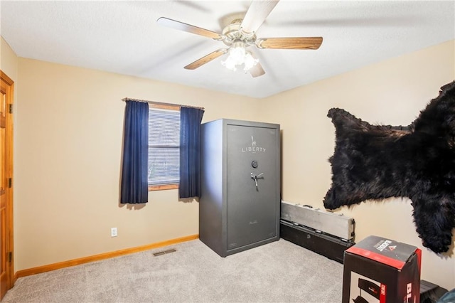 interior space featuring ceiling fan