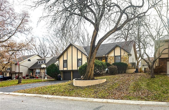 tudor home featuring a garage