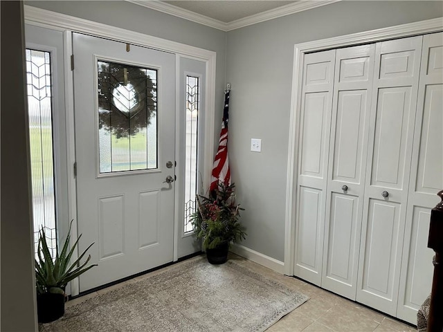 tiled foyer entrance with a wealth of natural light and crown molding