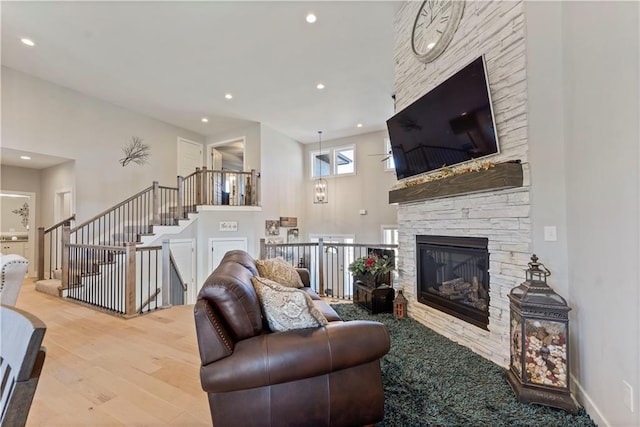 living room featuring hardwood / wood-style flooring and a fireplace