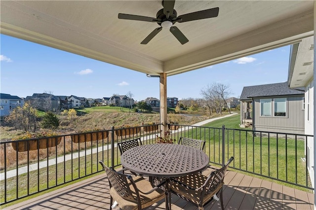 deck featuring a lawn and ceiling fan