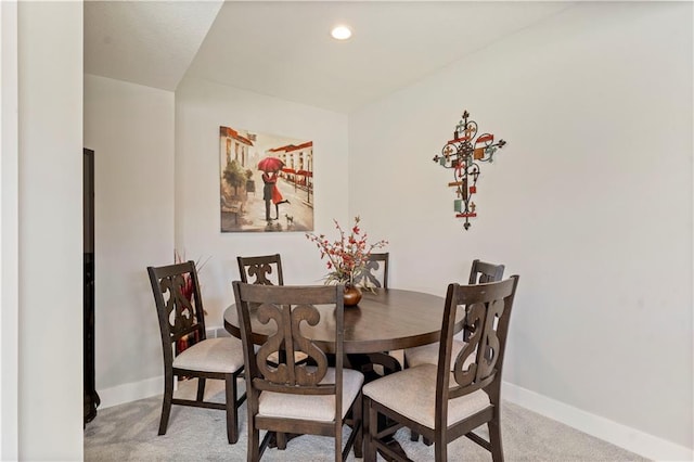 dining area with light carpet