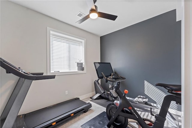 exercise area featuring carpet flooring and ceiling fan