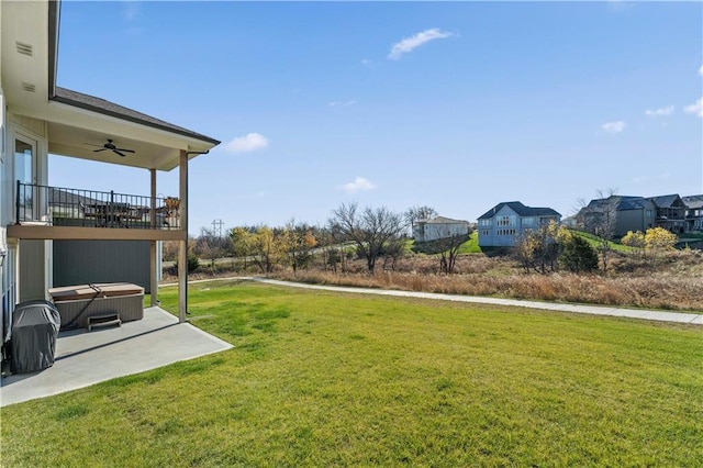 view of yard featuring a patio and ceiling fan